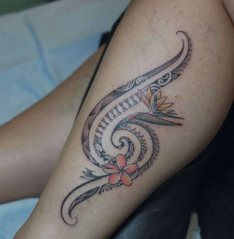 Colorful tribal and floral design on thigh