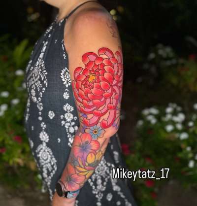 japanese traditional chrysanthemum half sleeve tattoo with red flowers