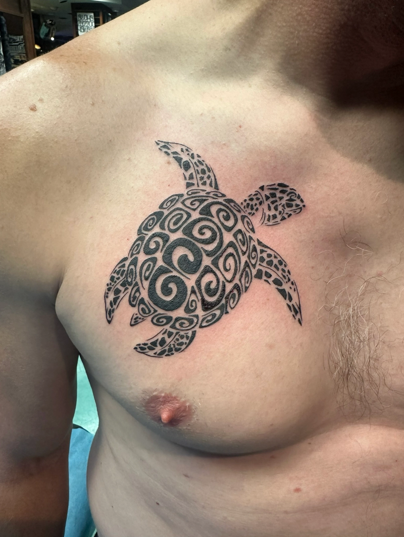 Blackwork tribal turtle tattoo on chest