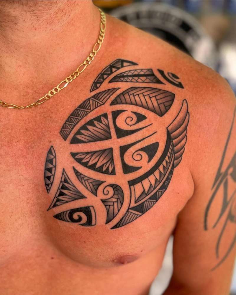 tribal tattoo on chest with turtle design