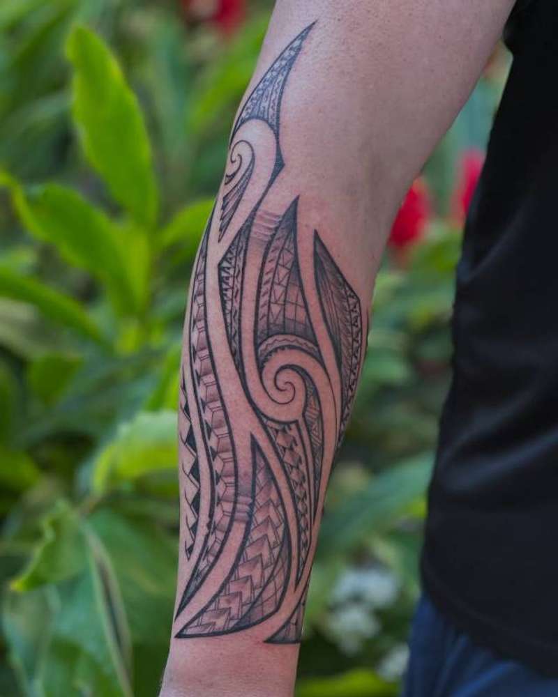 Tribal blackwork design on forearm