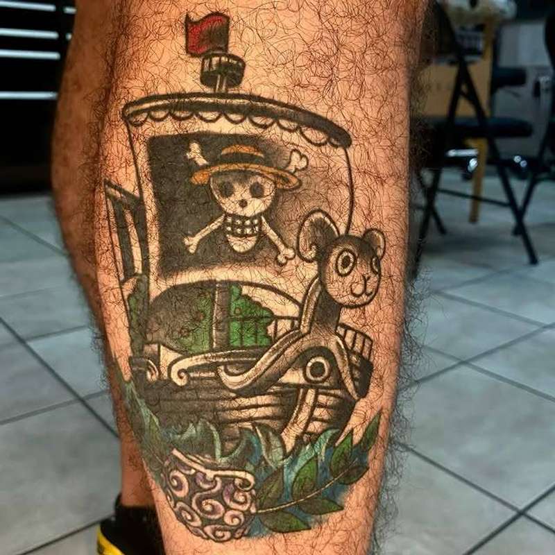 illustrative pirate ship tattoo on the calf