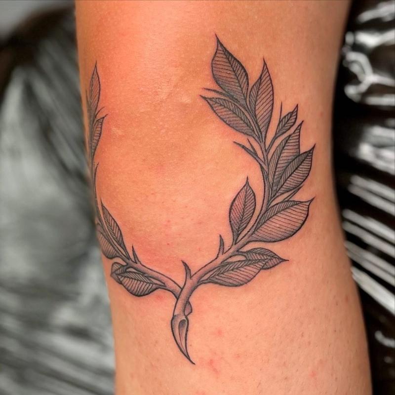 botanical branch tattoo in fine line style