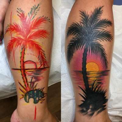 colorful palm tree tattoo with sunset on calf