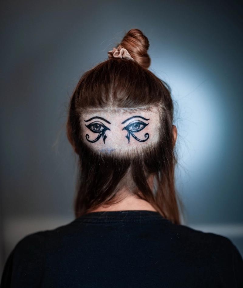 egyptian eye of horus tattoo on back of head