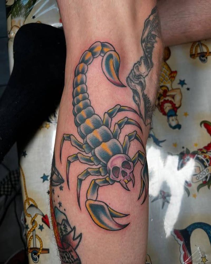 Colorful Neo Traditional tattoo of a scorpion with a skull on calf