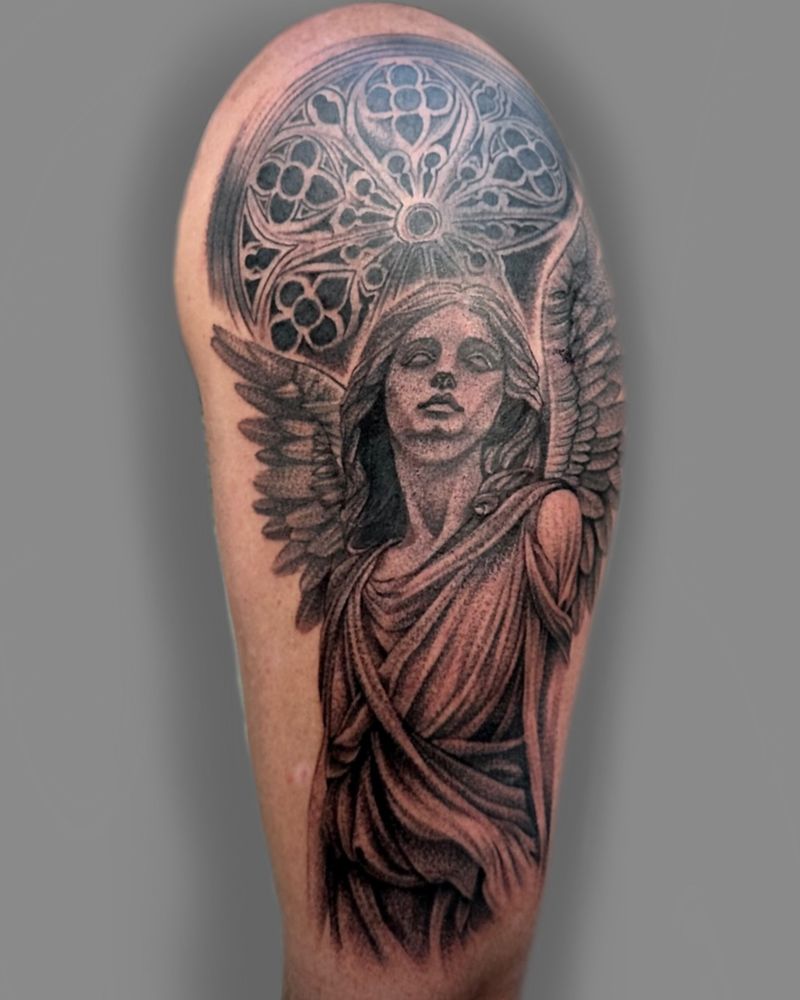 Black and grey realistic angel tattoo on upper arm