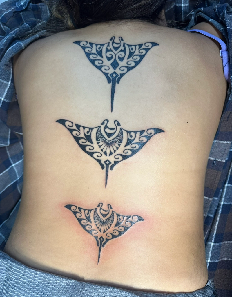 Black and grey tribal stingray designs across full back