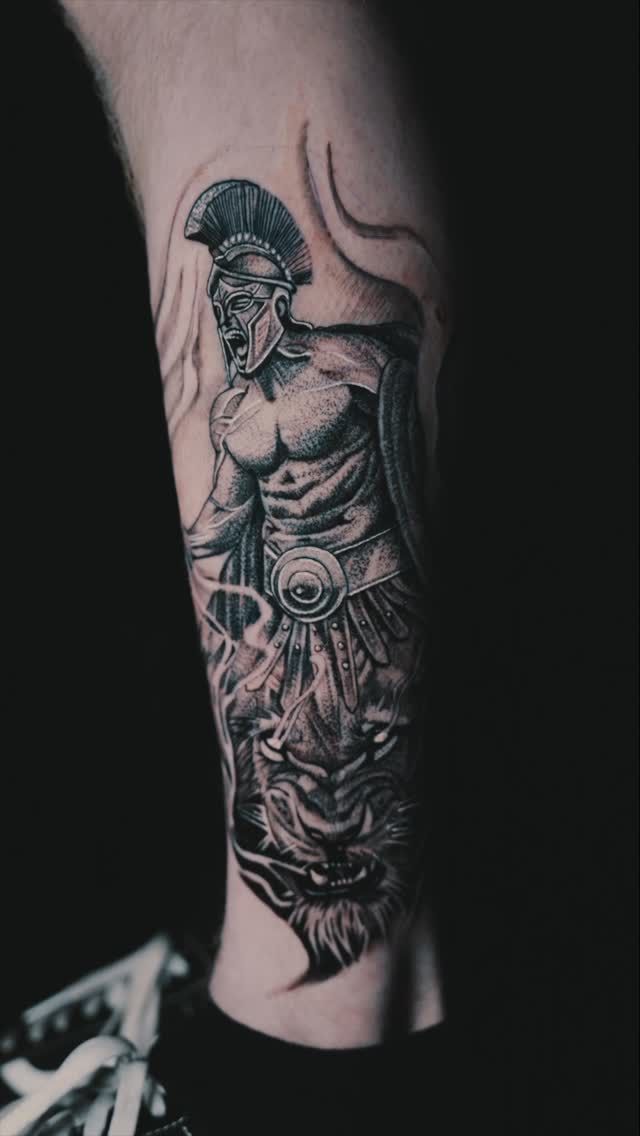 Black and grey realistic Greek warrior and tiger on forearm