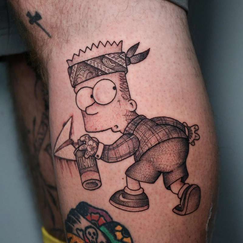 cartoon character tattoo with spray can on thigh