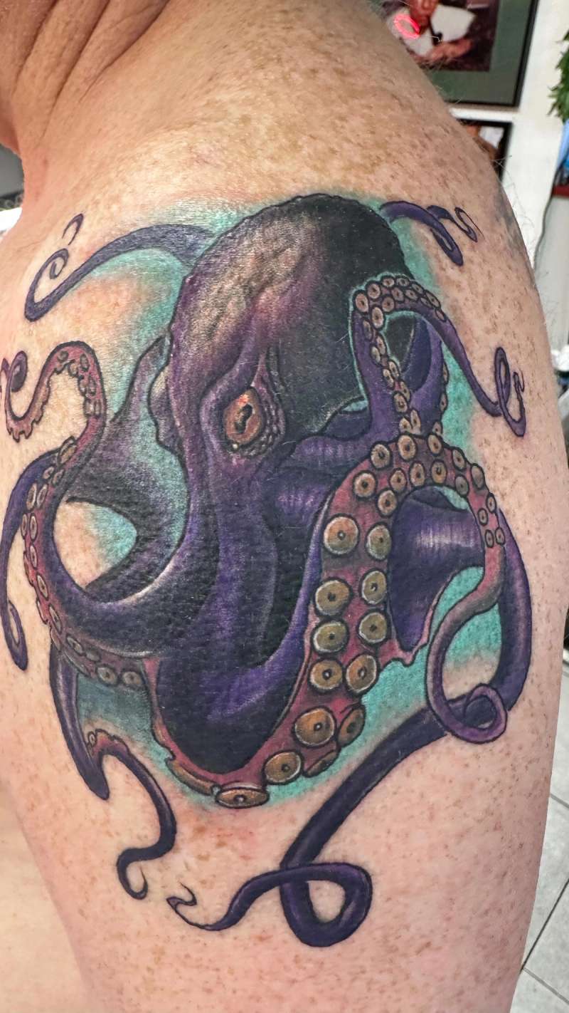 colorful octopus tattoo on shoulder