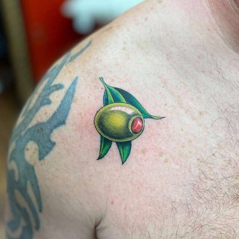 color tattoo of an olive on a shoulder