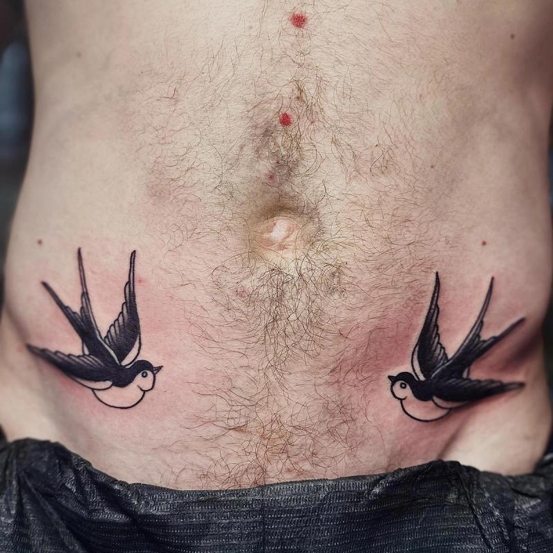 traditional swallow birds tattoo on torso.