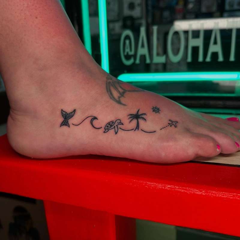 small minimalist ocean-themed tattoo on foot