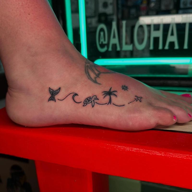 small minimalist ocean-themed tattoo on foot