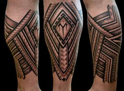 Black and grey geometric tribal tattoo on the calf