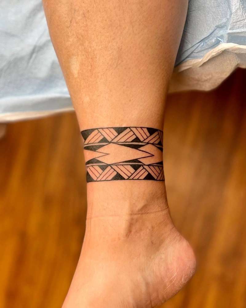 geometric tribal design tattoo on foot