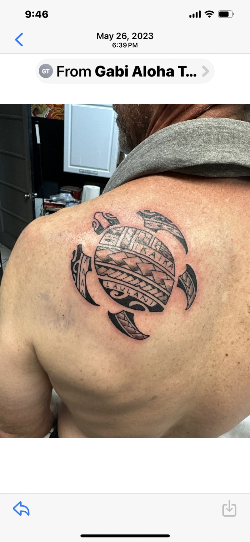 Tribal blackwork turtle tattoo on the upper back