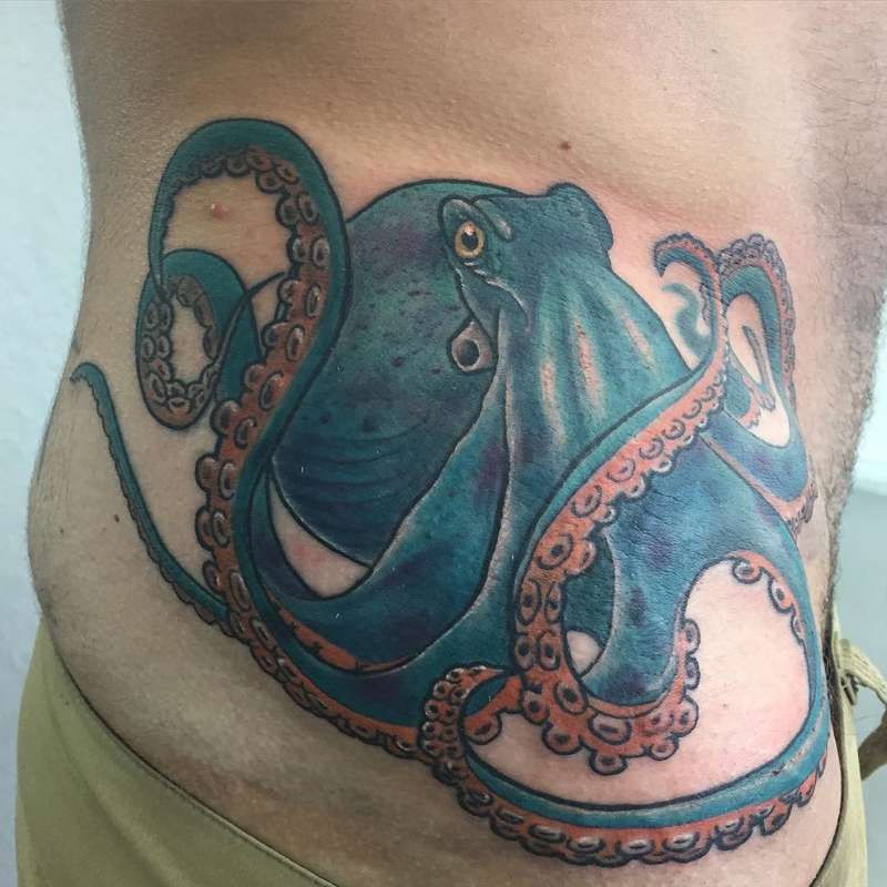 colorful octopus tattoo on torso