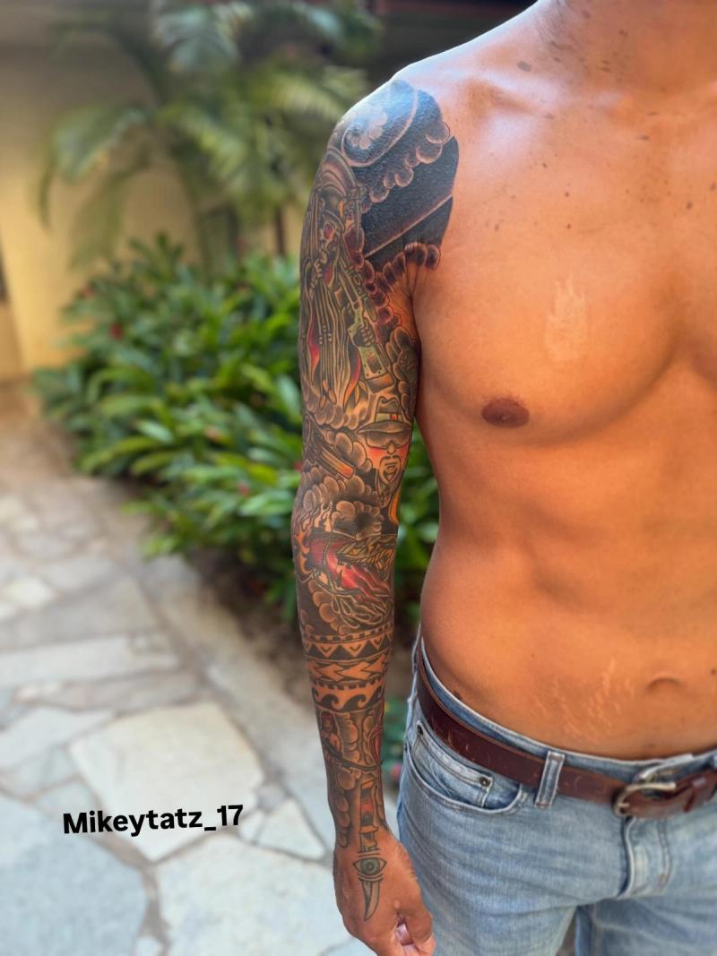 japanese traditional full sleeve tattoo with samurai mask and clouds