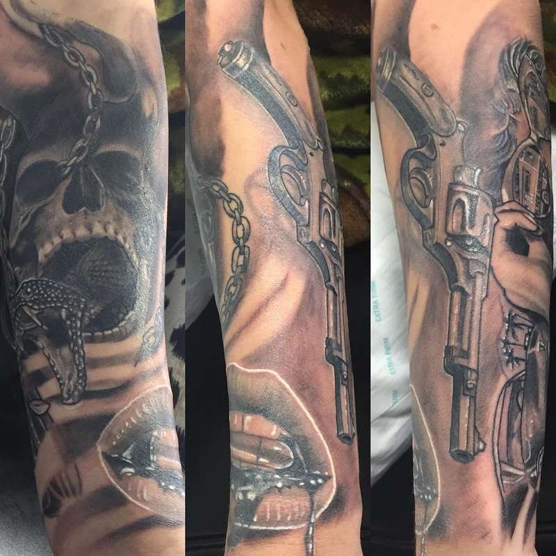 Black and grey realistic skull and revolver sleeve on forearm
