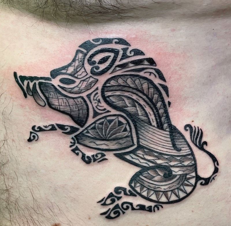 Blackwork tribal boar tattoo on torso
