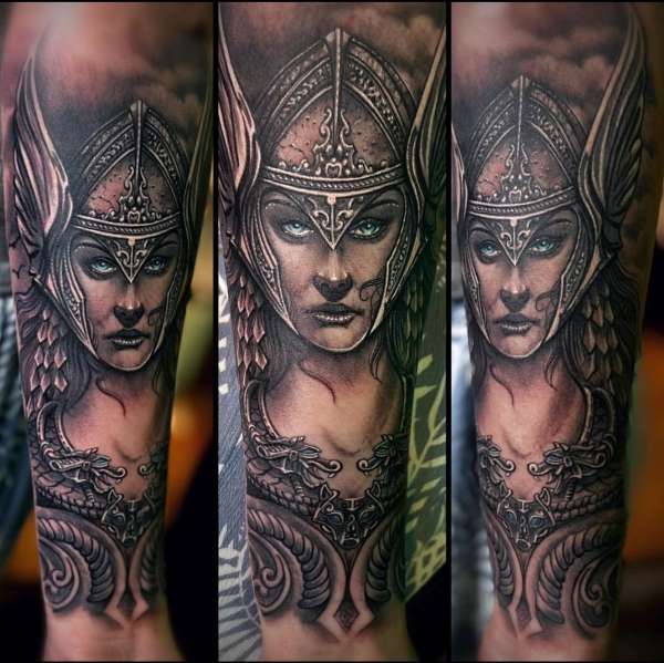 Black and grey realistic Viking warrior portrait tattoo on forearm