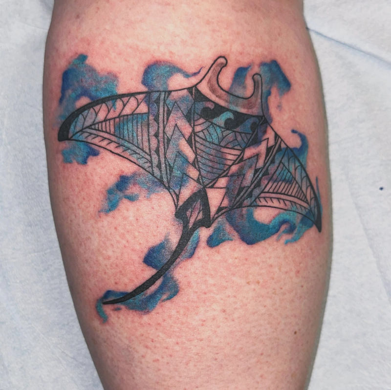 Colorful geometric manta ray tattoo on calf