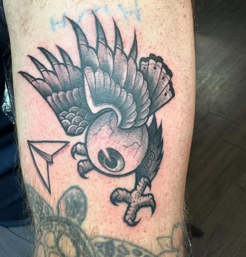 Black and grey neo traditional owl tattoo on upper arm