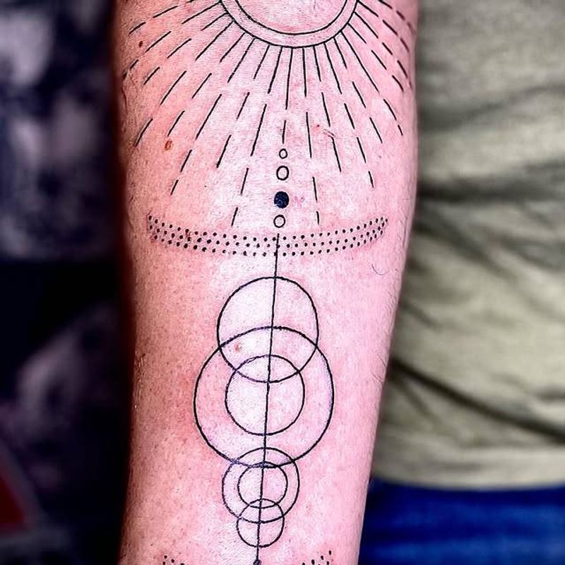 geometric and dotwork tattoo on forearm