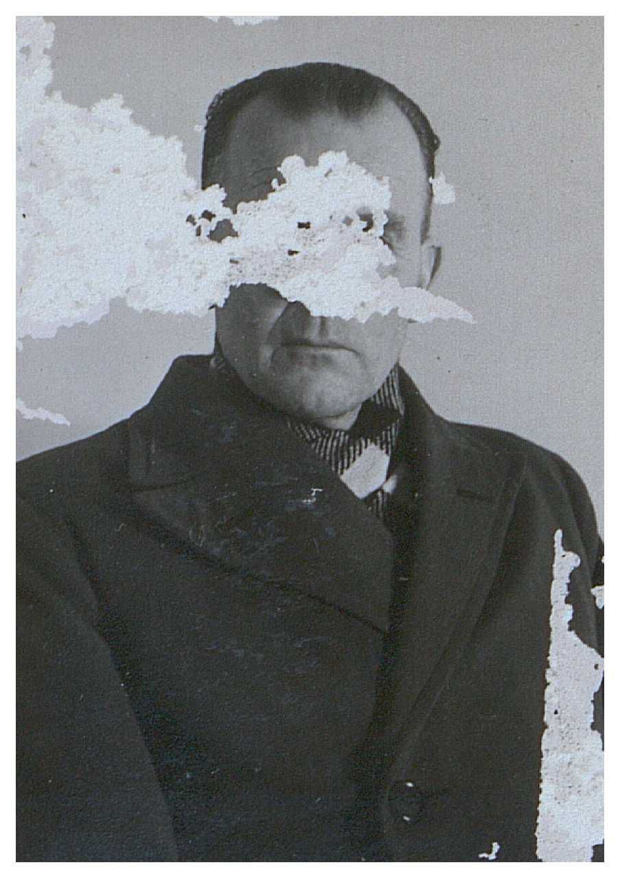 Photograph of a person from the Danish resistance movement, face scratched out