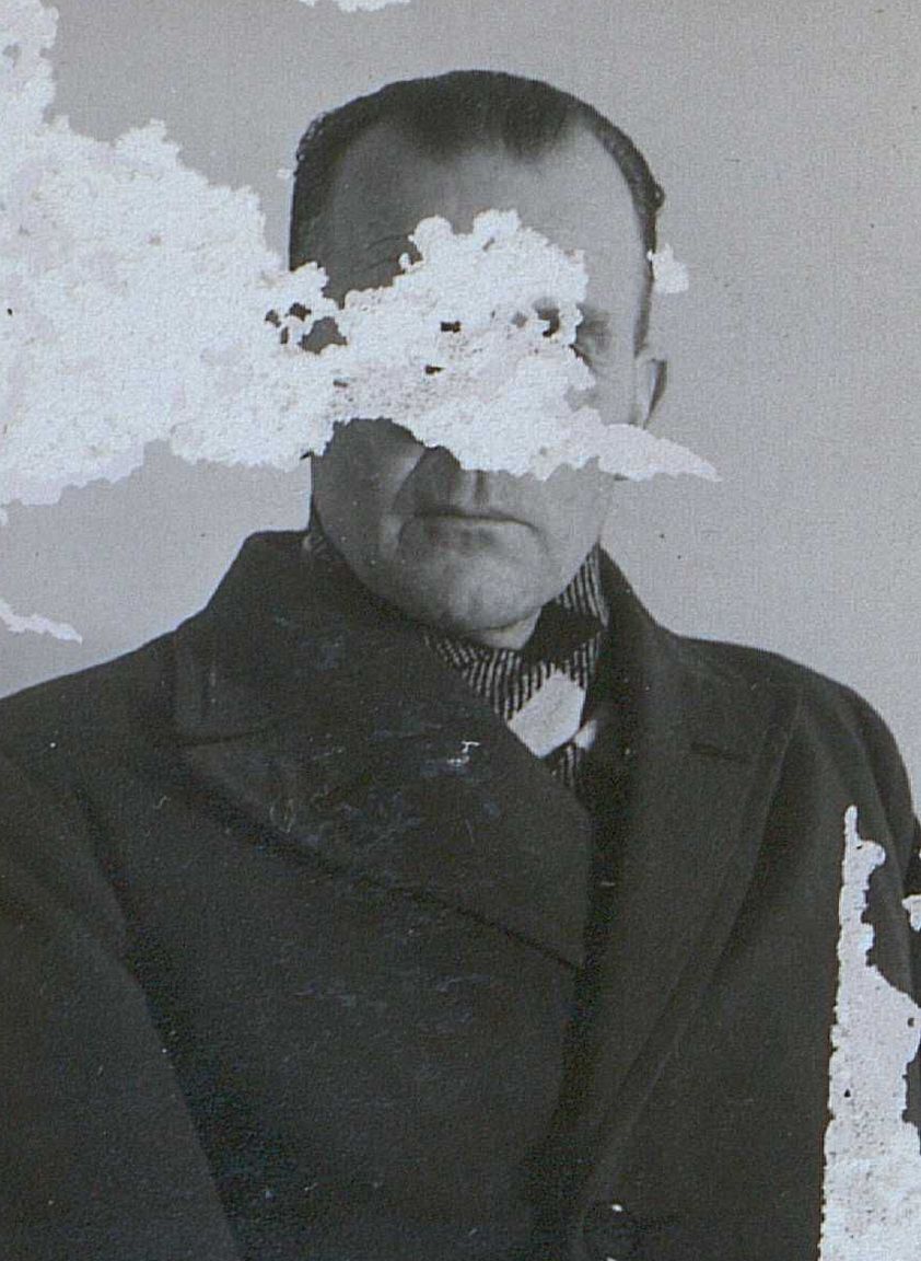 Photograph of a person from the Danish resistance movement, face scratched out