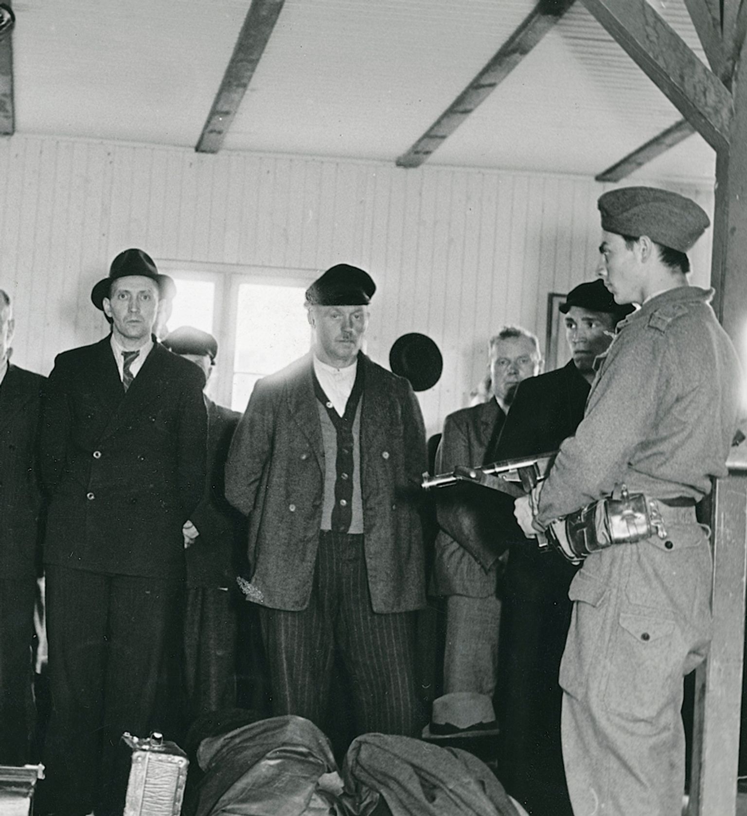 Prisoners guarded by soldiers from the Danish Brigade after their arrival at the Fårhus camp on May 10, 1945.