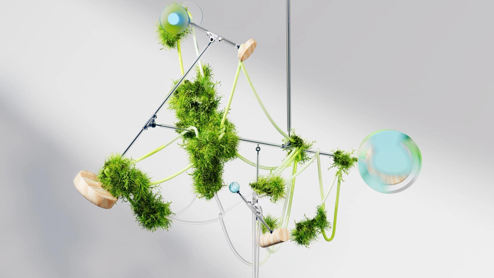 Suspended moss-and-glass kinetic sculpture