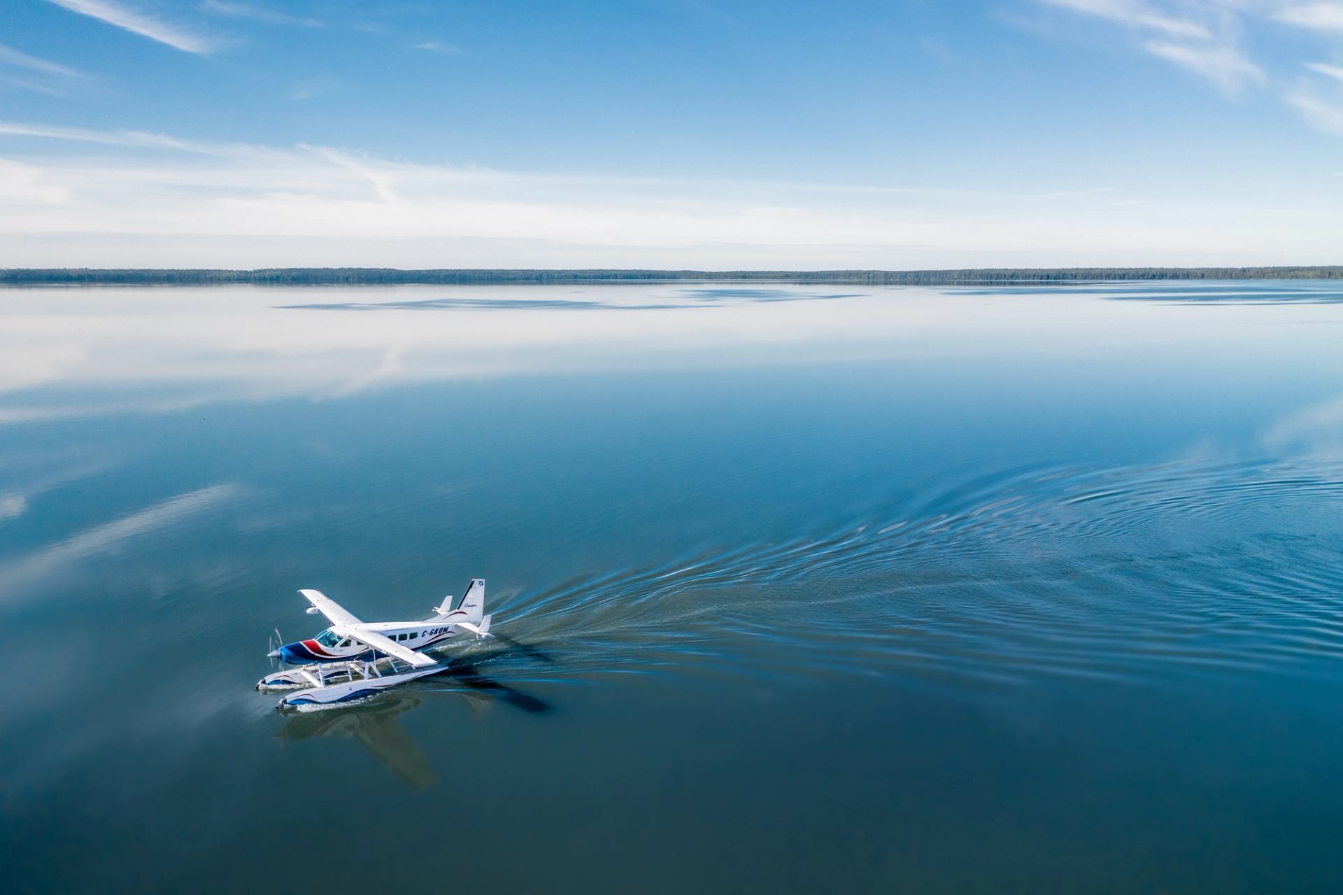 Float plane landing on a lake