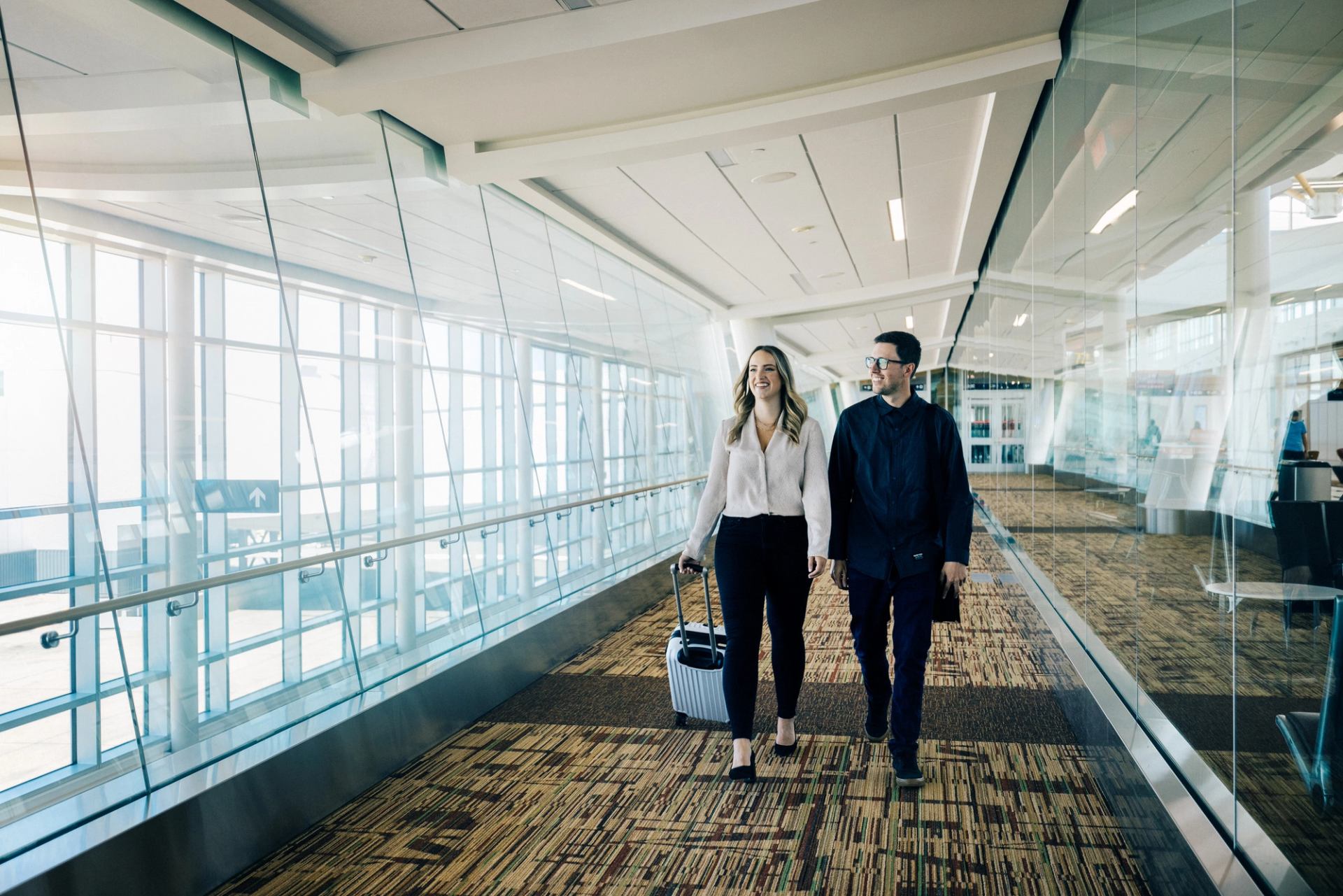 A couple walk in Edmonton International Airport. Credit: Travel Alberta / Cooper & O’Hara