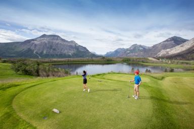 Couple golfing at Waterton Lakes Golf Course