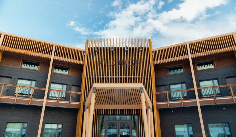 The exterior of a modern, Indigenous-run hotel in Alberta.