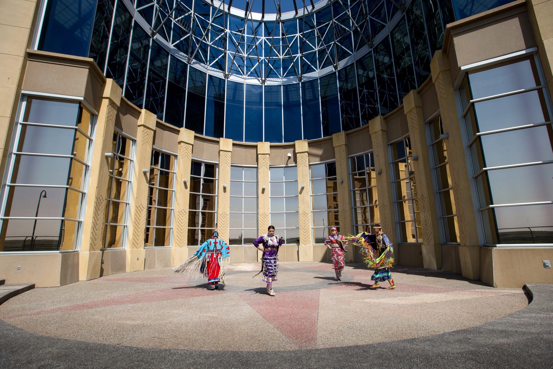 Siksika Blackfoot dancers in front of the Blackfoot Crossing Historical Park Interpretive Centre