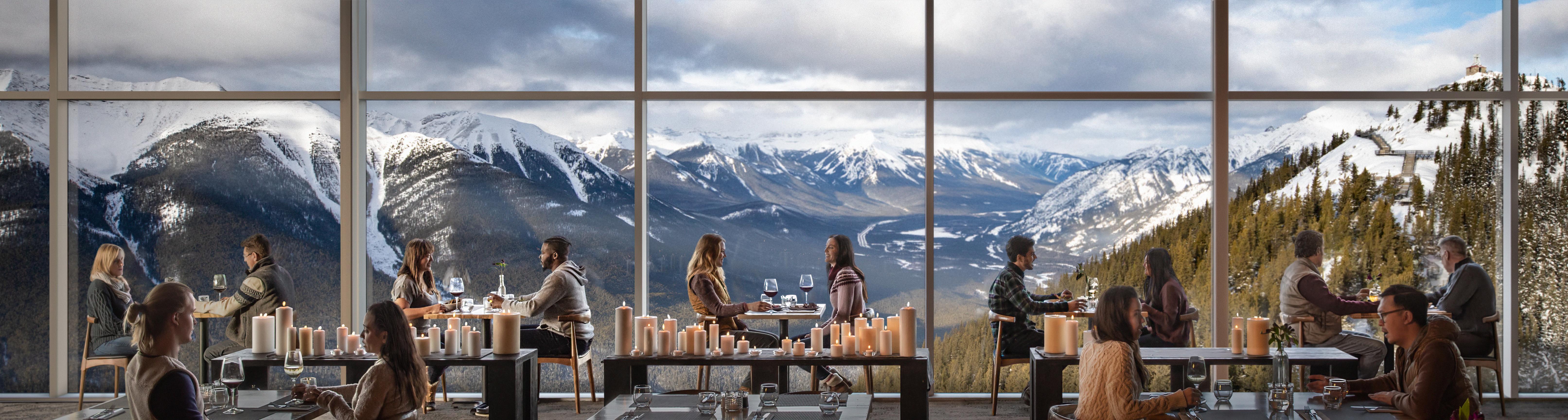 Diners sit against a large window at Sky Bistro in Banff Alberta.