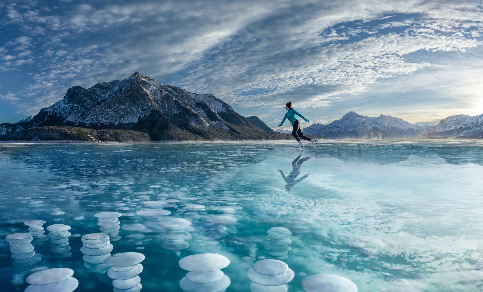 Picture of a person skating on a frozen lake
