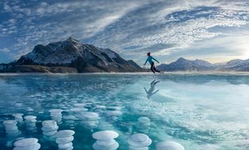 Picture of a person skating on a frozen lake