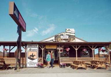 Couple in front of the Beef Jerky Store in Longview.