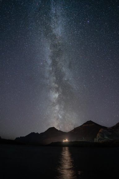 A sky filled with stars above the mountains and the Prince of Wales Hotel in Waterton.