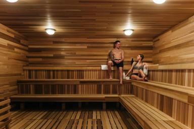 A couple enjoying the quiet time in a sauna at the Nordic spa