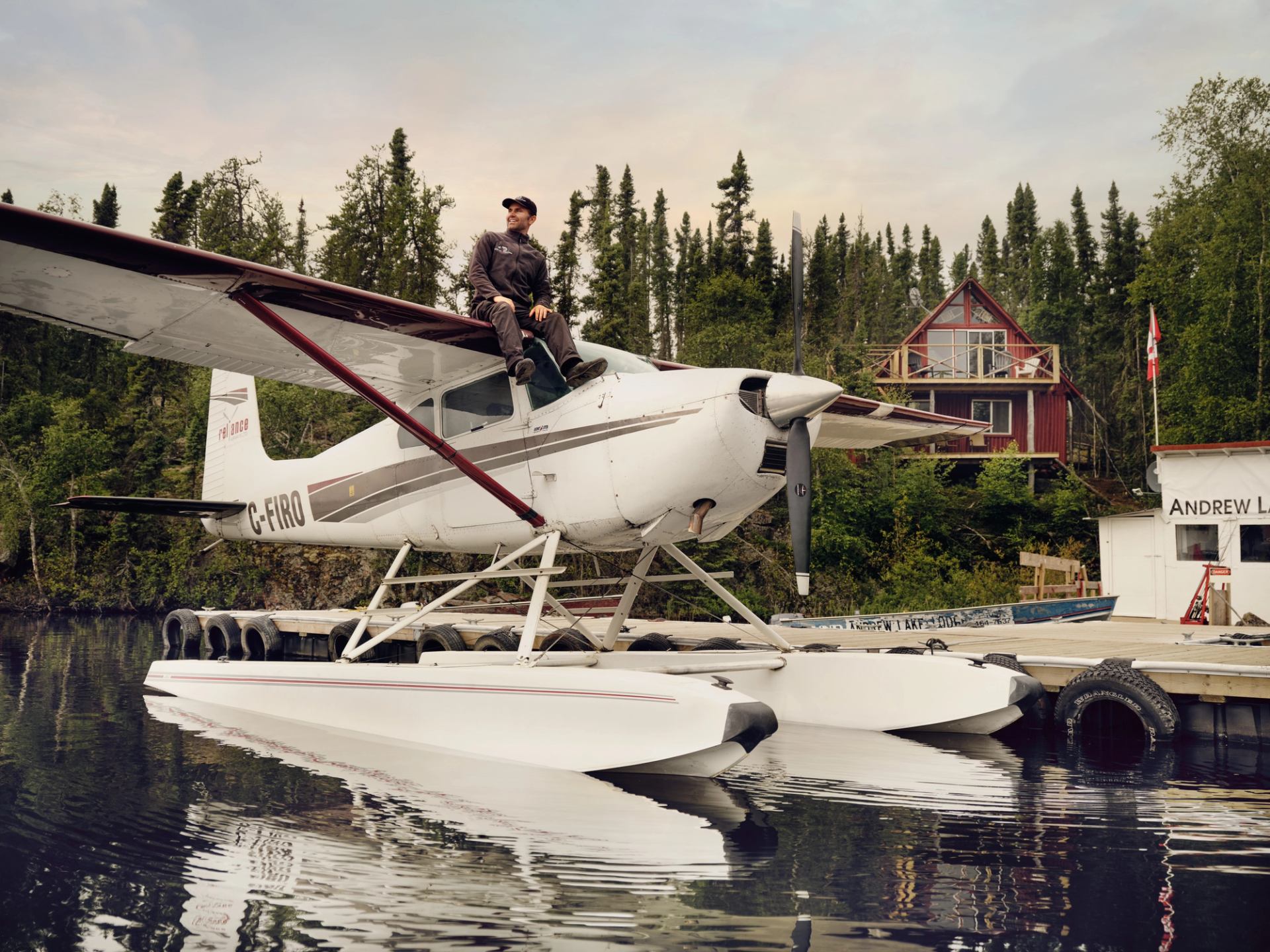 Tony Moulatsiotis (Pilot) sitting on top of float plane