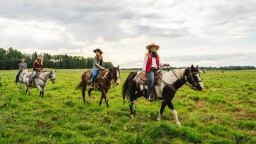People horseback riding at Wildhorse Ranch