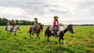 People horseback riding at Wildhorse Ranch