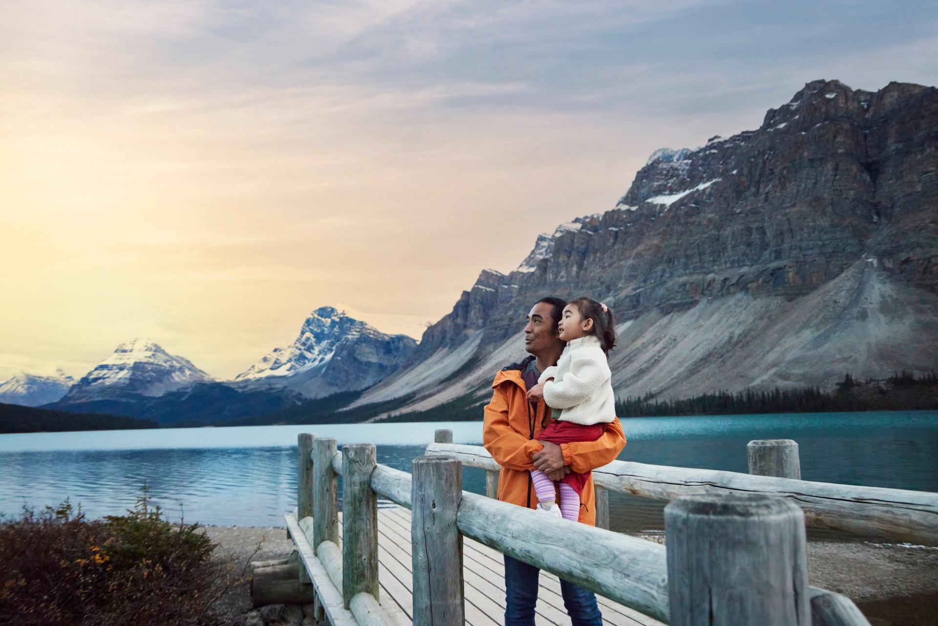 Father and daughter enjoying Bow Lake in Banff National Park