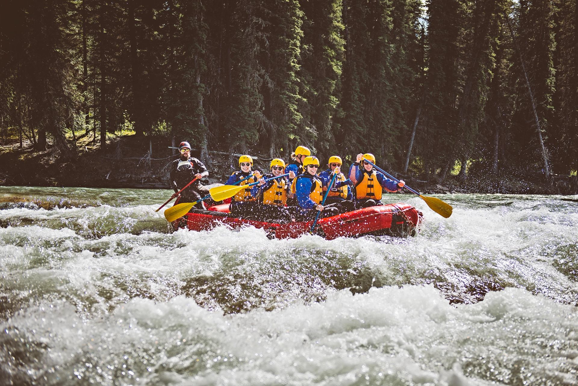 Group on a raft from Mukwah Rafting going down Panther River.